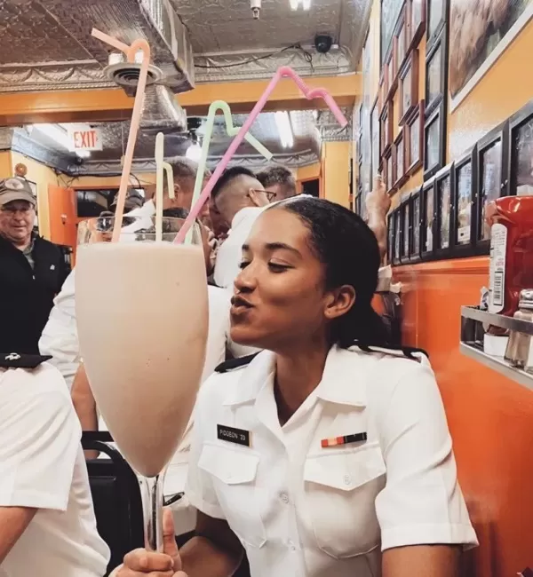 Customer participating in the Colossal 6lb Milkshake Challenge at Chick and Ruth's.